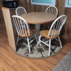Table And Four Chairs And Rug