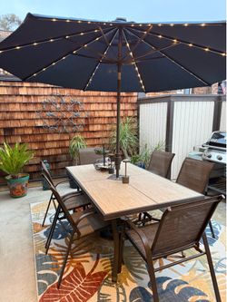 Outdoor table and solar light unbrella
