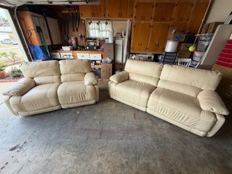 Cream Colored Leather Dual Power Recliner Couch and Loveseat