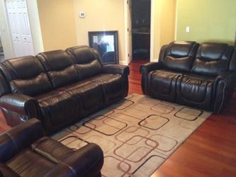 Brown leather fully reclining couch set