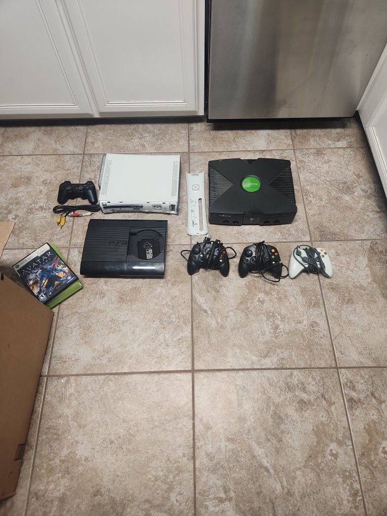 2 Old XBox And Old PS3 Consoles With Different Remote Controllers , Many Cords For Electronics 