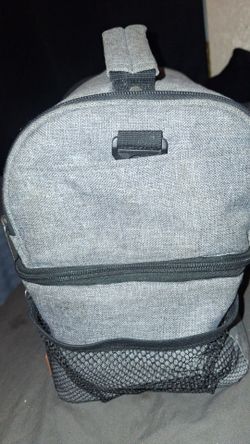 Grey and blue colored lunch box with 7 pockets, by ( STNTUS innovations)