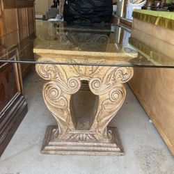 Beautiful cast concrete leg and glass dining table.   80” long x 48” wide x 30” high 6 dining chairs