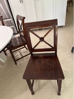 7 solid Wood dining chairs.
