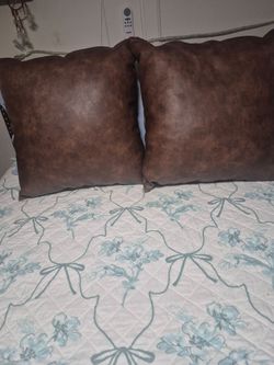 2 Couch Faux Leather pillows 19by19, good condition, $30.