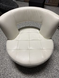 White Upholstered Barrel Tub Accent Chair is a stylish and comfortable seating option for adults in an indoor setting. The solid white color and uphol