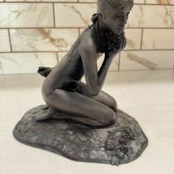 Signed M. Stelzer for Franklin Mint statue dated 1980, "Kneeling Nude (Girl) with Flowers"