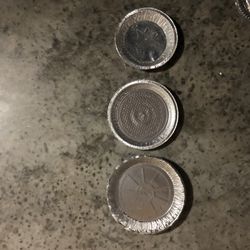 13 Pie Tins - 5 small, 6 medium, 1 large with some plastic covers.