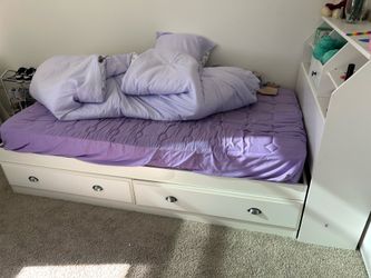 Twin wooden bedframe with bookcase headboard