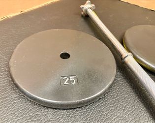 Standard 6 ft Gently Used Bar ( Split in 2 pieces) with pair of Cast Iron Plates of 25#, 10# and 5 pounders. Brute Weight: 100 #