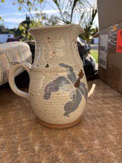 Pitcher with flowers on it