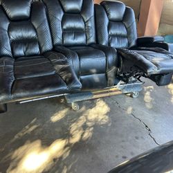 Electric Black Couch Both Seats Recline Console Has Two Outlets In the center Head Rest Has Function Lights 1 USB Outlet On Both Sides 
