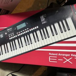 Roland E-X10 Arranger Keyboard with Music Rest and Power Adapter