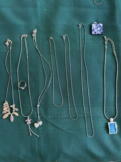 Costume Jewelry Silver Necklaces, lot of 9 pieces, 7 necklaces, 1 matching ring, 1 additional pendant, excellent condition.