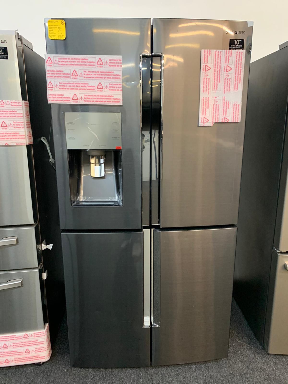 New-Samsung Four Door Refrigerator in Black Stainless