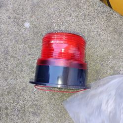 Red industrial strobe warning light
