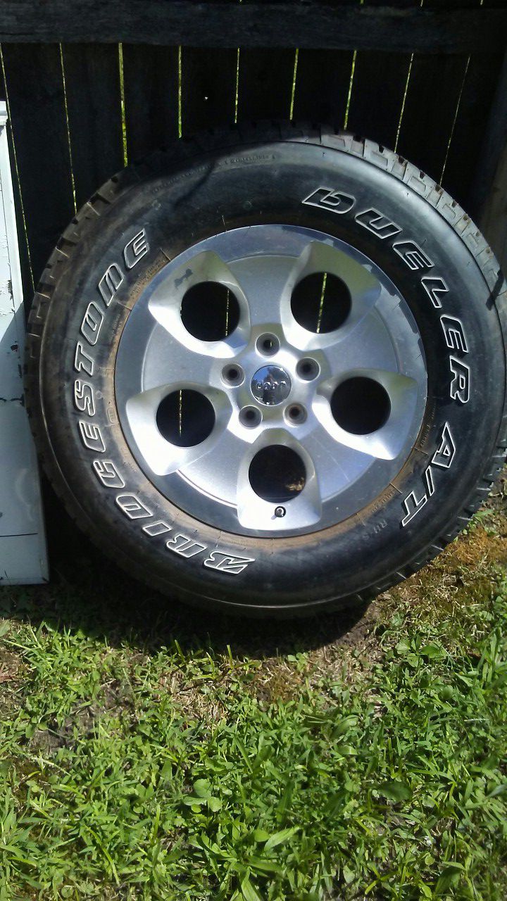 One Jeep 18 inch wheel & tire