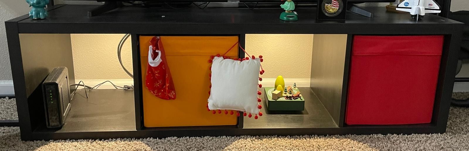 TV Shelf along with colored boxes