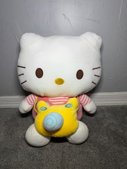 Jumbo sario hello kitty plush pink stripped shirt with yellow camera crossbody