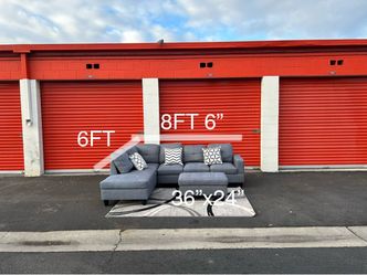 Grey sectional sofa and ottoman