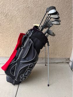 Warrior Graphite 3,4,5,6,7,8,9,SW,LW,GW Irons & 1,3,5,7,9 Metal Woods, PutterAlong with OGIO Lightweight Golf Bag