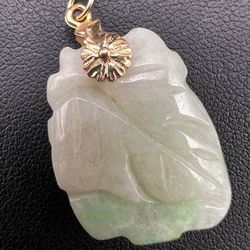 Incredible green jade pendant 6.1 grams with 18k gold pendant mount