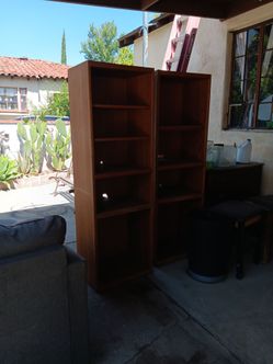 2 solid wood book cases 25 ea
