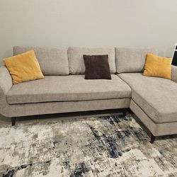 Biege Couch and Sleeper.