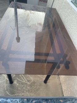 Two used glass tables.