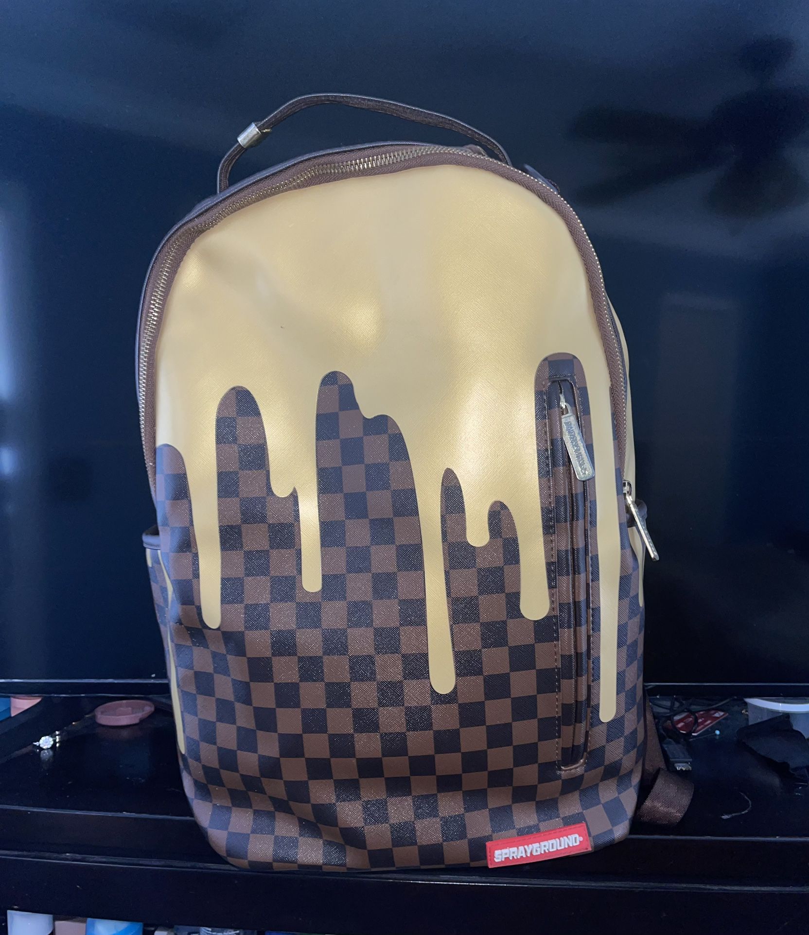 Sprayground Gold Checkered Drips Backpack