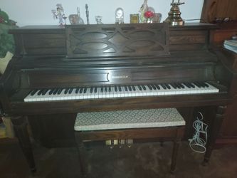 Sherman Clay stand up piano and bench.
