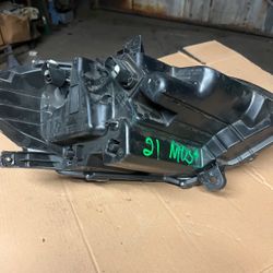 21 mustang  left headlight used 80.00 