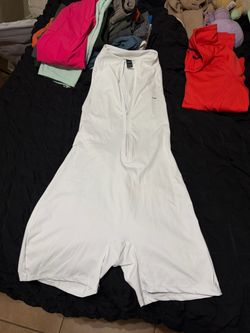 White sleeveless open back romper
