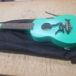 Makala Surf Green Soprano Shark Ukulele - MK-SS/GRN Bundle with a Tuner and Polishing Cloth
