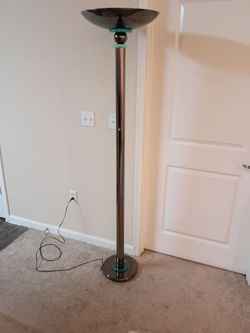 Halogen 300 Watt Torchiere Floor Lamp, Metal & Glass Frame 72"HX11"D(Base), 16"D(Shade).
A new Halogen 300 Watt will be required.