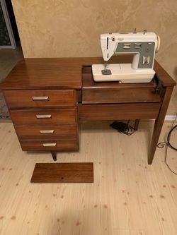 Antique Singer sewing machine cabinet with new machine - reduced