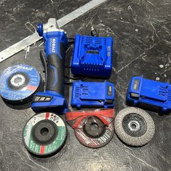 Grinder with 2 batteries a bunch of cutting wheels and safety glasses