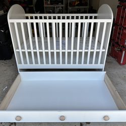 White IKEA Crib With Storage Drawer