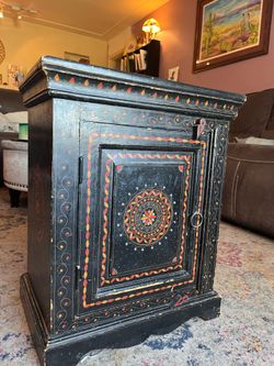 Ornate painted cabinet side table