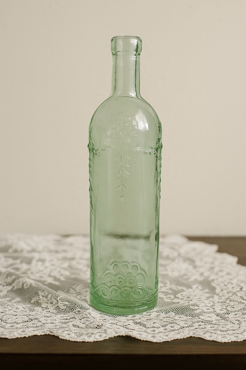 Vintage 1960s Green Glass Bottle Floral & Garland Embossed, 12”