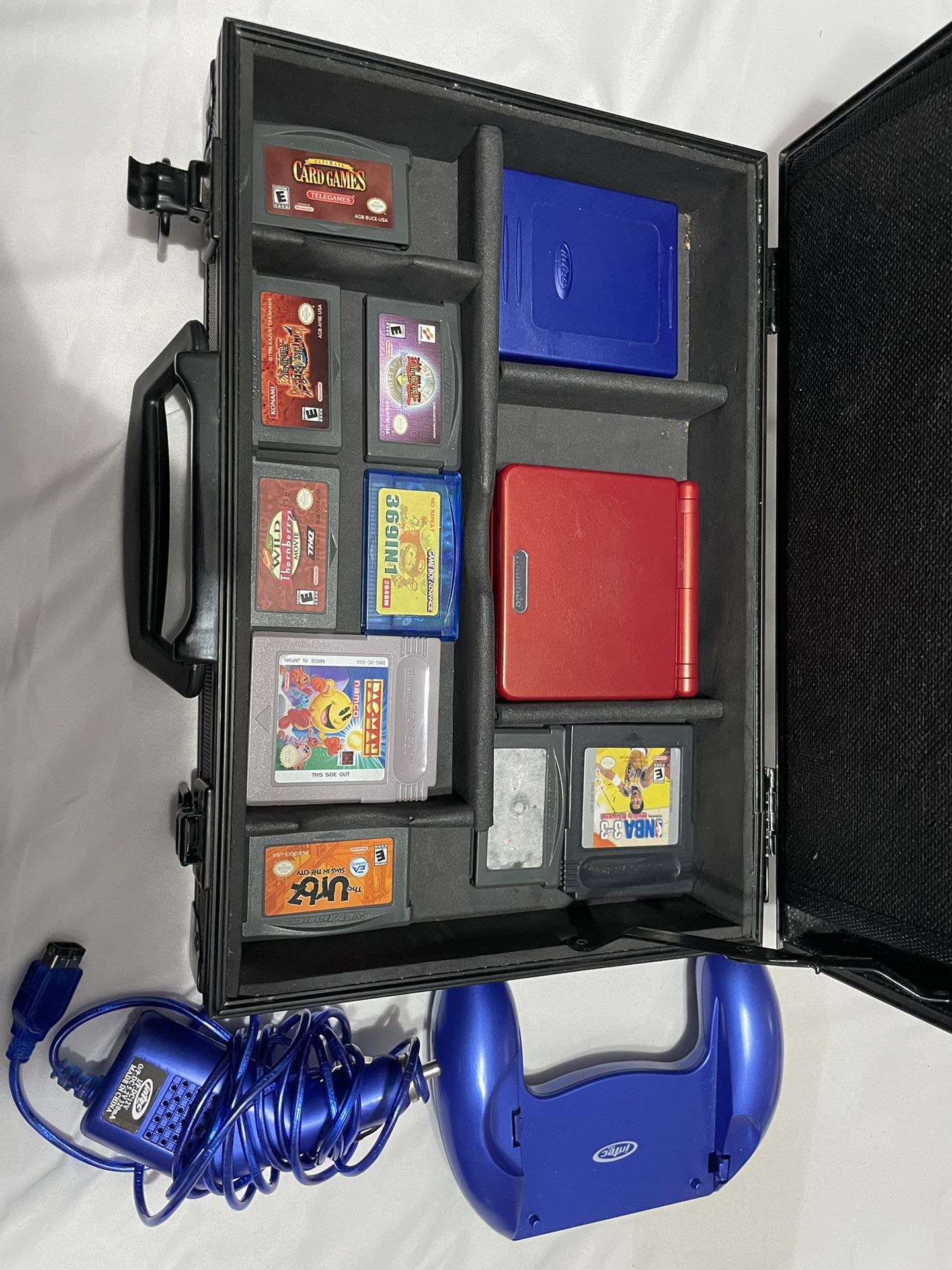 Gameboy advance sp with games, charger, game case and controller