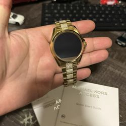 Michael Kors smart watch gold used once or twice comes with charger and extra accessories
