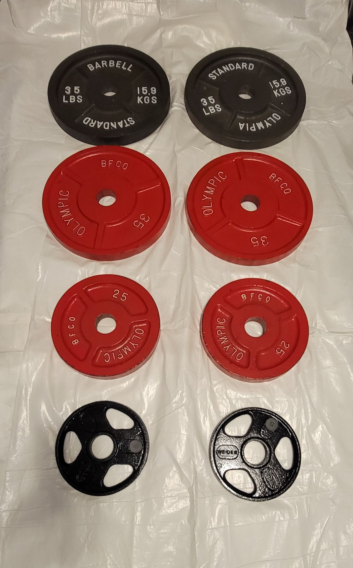 200 LBS set of steel Olympic plates 2 inch diameter for sale 