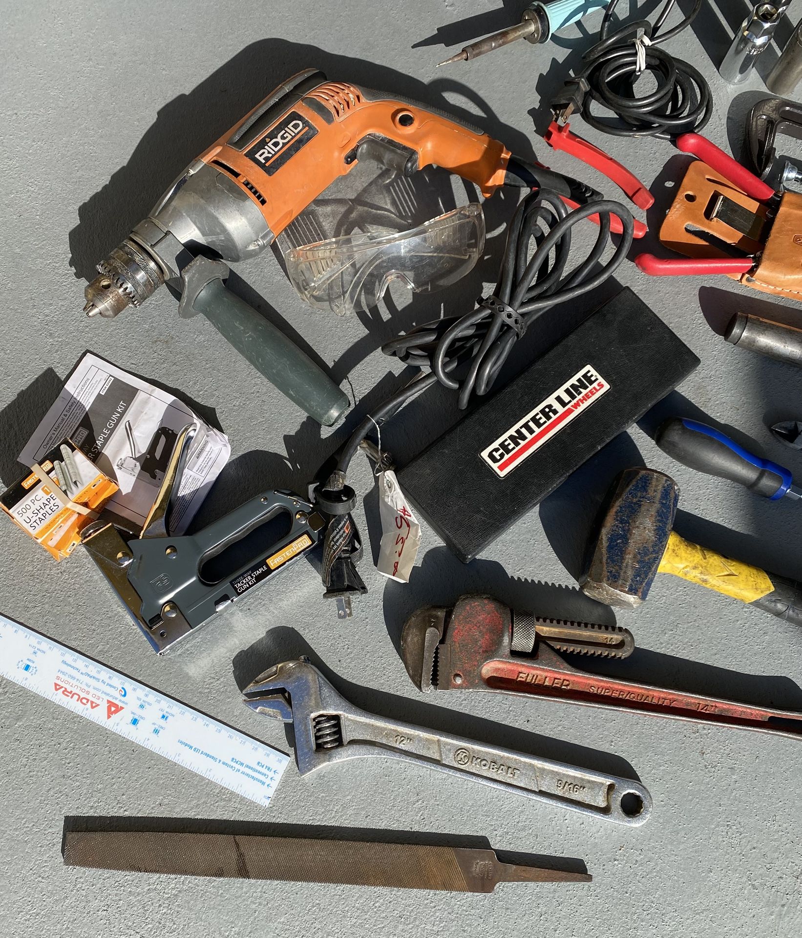Lot of tools, half-inch drill pipe wrench, crescent wrench, garden shears, and more!
