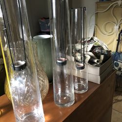 Set of 3, tall glass candle holders with iron drop down votive holder