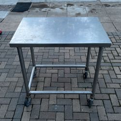 2 Stainless Steal Rolling Tables. 