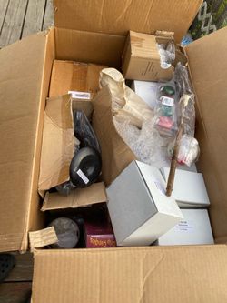 Two big boxes of candles and decor