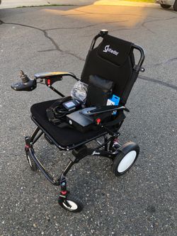 Folding power wheelchair with extra battery