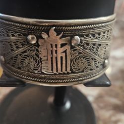 Then a silver cuff designed