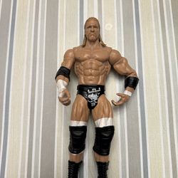 2010 MATTEL WWE TRIPLE H ACTION FIGURE.